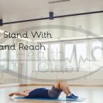 Sit-Up to Stand With Jump and Reach